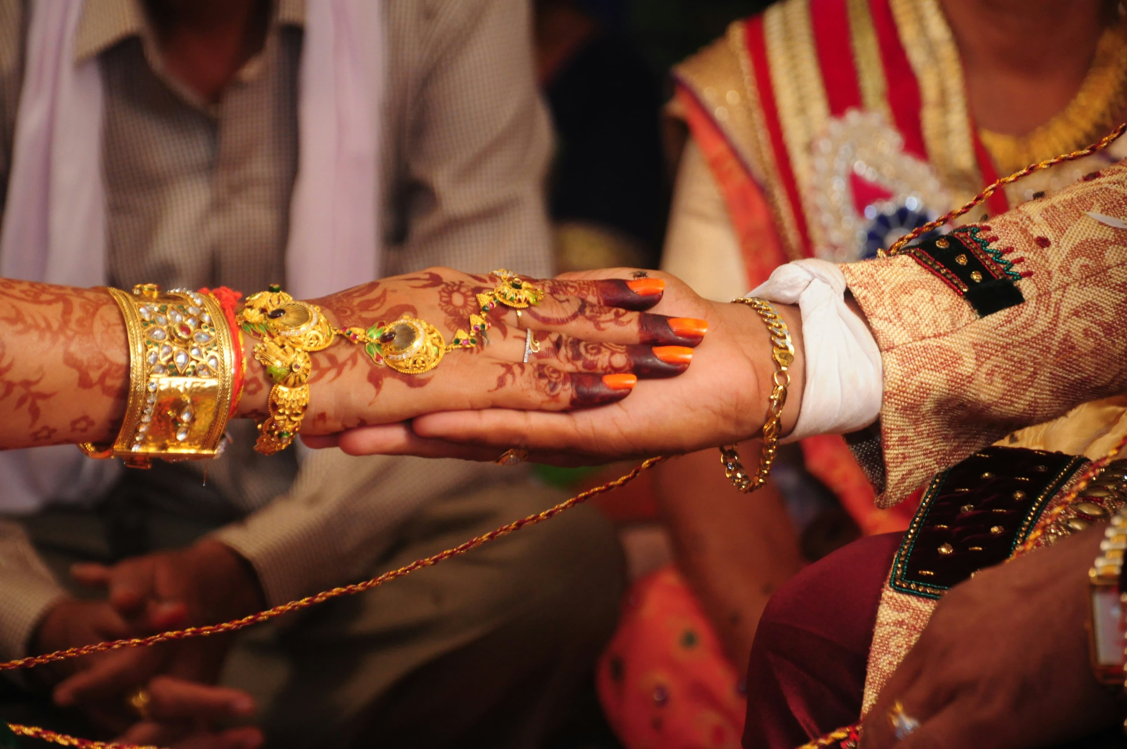 Bride and groom holding hands during ceremony