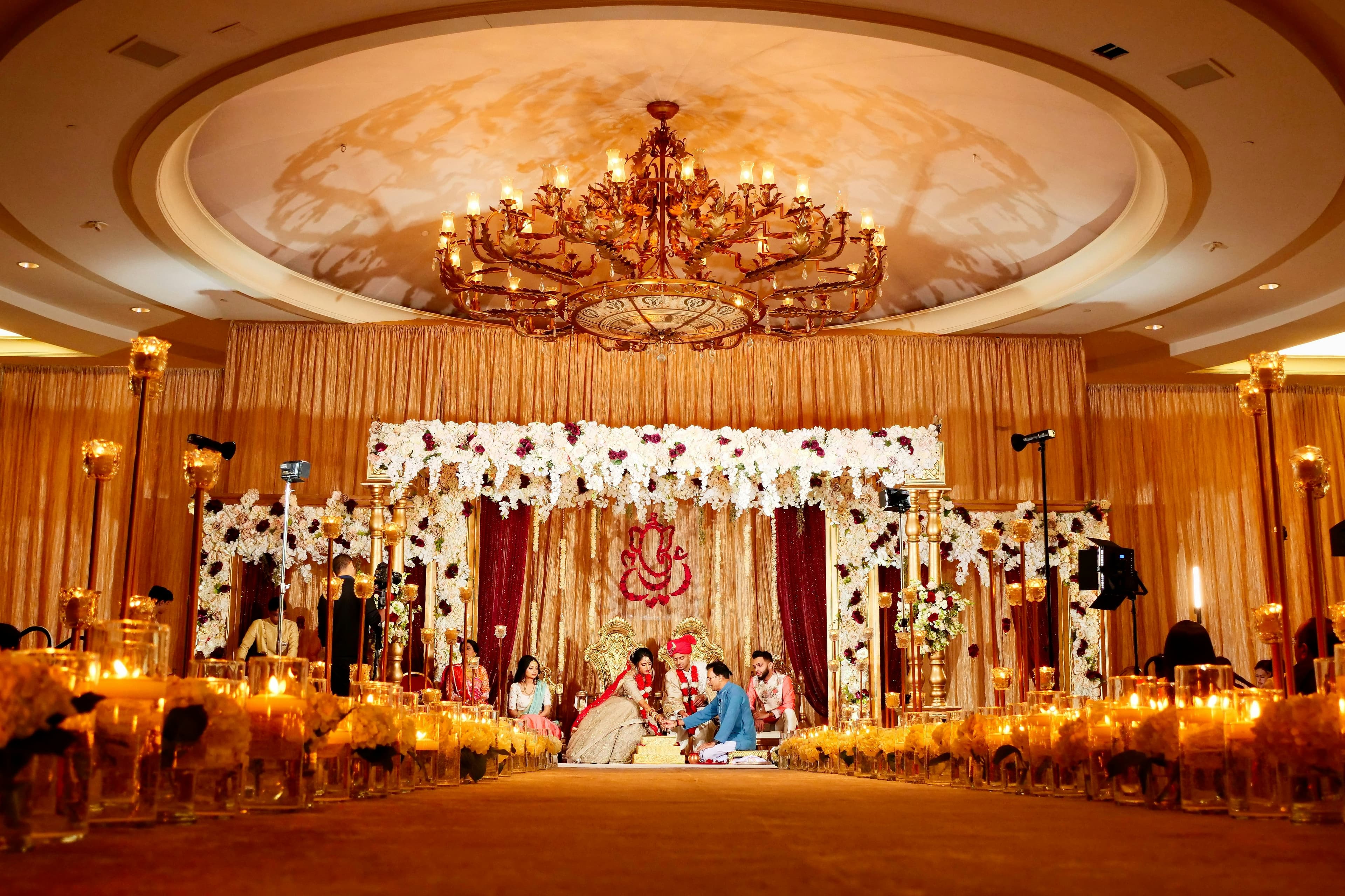 Bride in saree with jewelry holding mirror